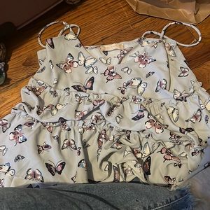 top with butterfly’s and it’s a size xs I know it might look big but it’s small